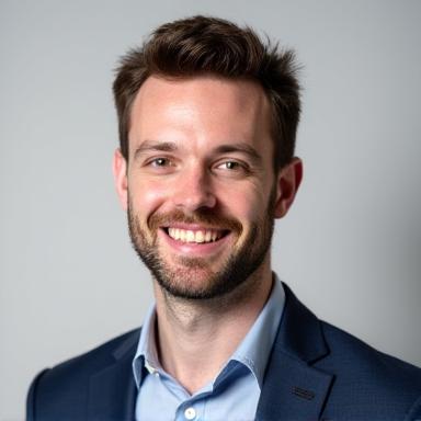 Professional headshot of Liam Hayes.